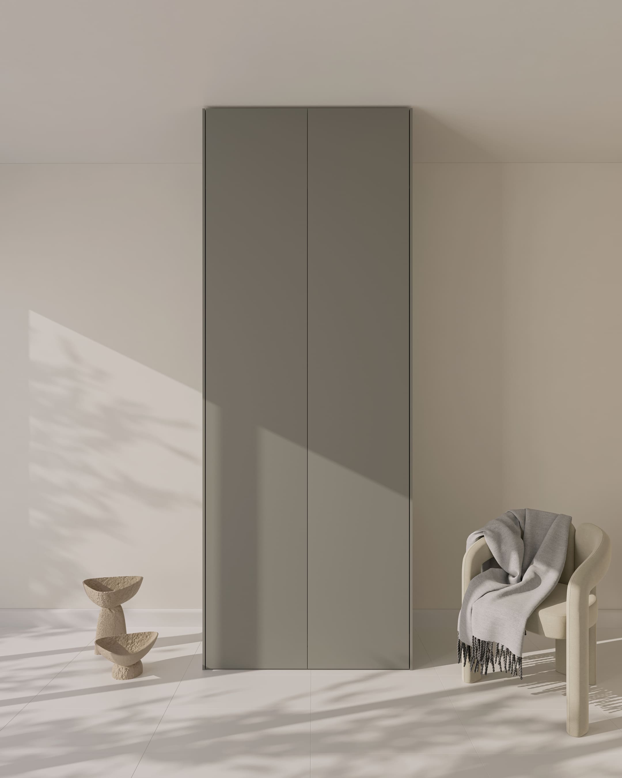 Zwei bodentiefe, ultramatte graue PAX Schranktüren in einem minimalistischen Raum.