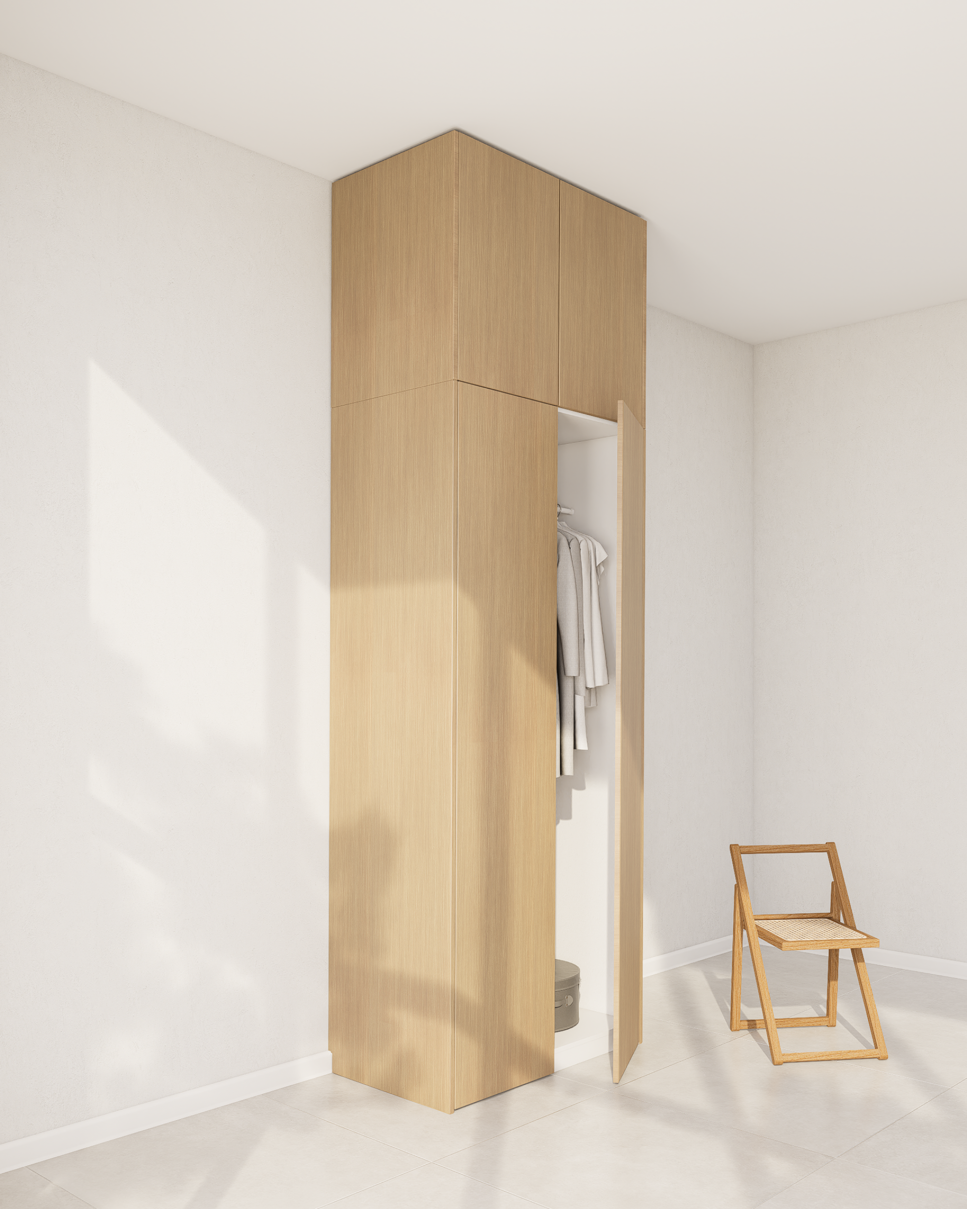 Ein PAX Aufsatzschrank mit einer hellen Echtholzfurnier-Front in einem minimalistischen Raum.