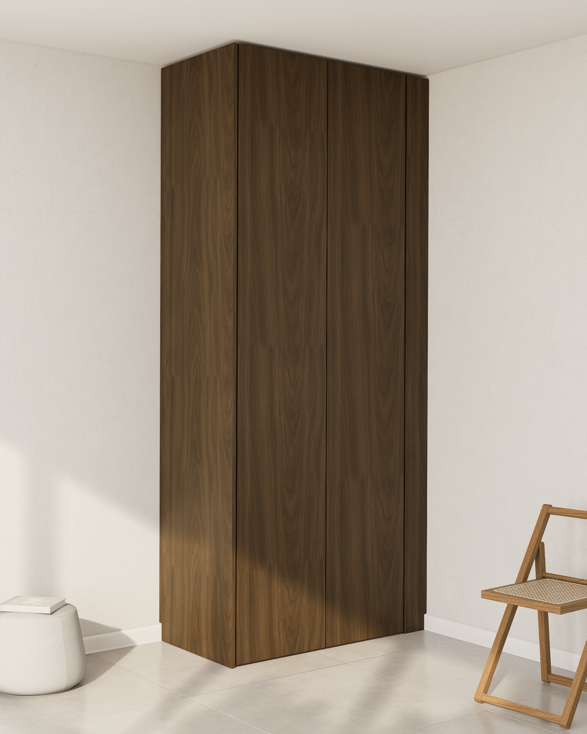 Eine maßgefertigte Wandblende aus dunklem Echtholzfurnier für einen PAX-Schrank.