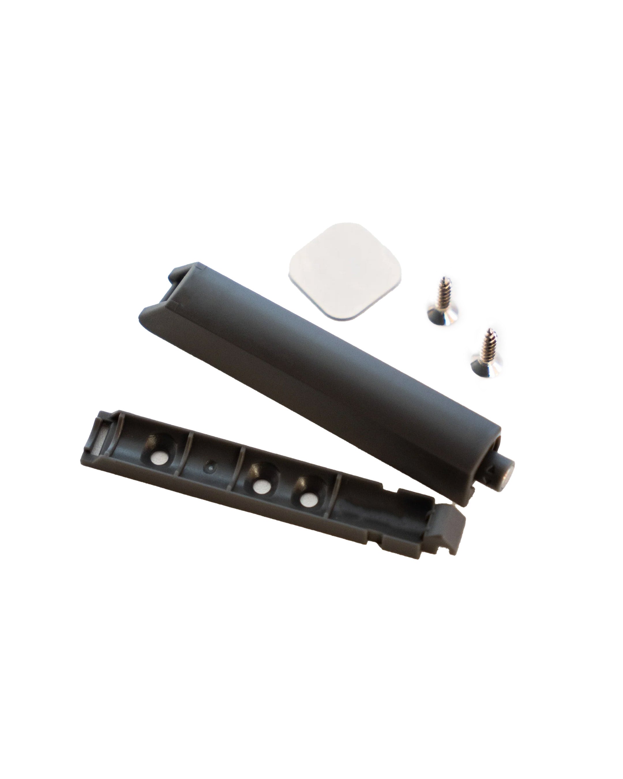 Ein Push-to-open-Drucktüröffner für PAX-Schränke mit Montageplatte, Schrauben und Klebepad.